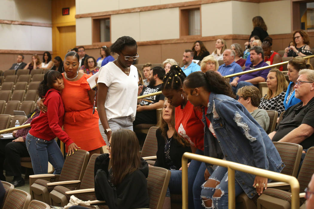 Shadow Ridge High School senior Queen Starling, left, gets a hug from Shadow Ridge Dean Cristal ...