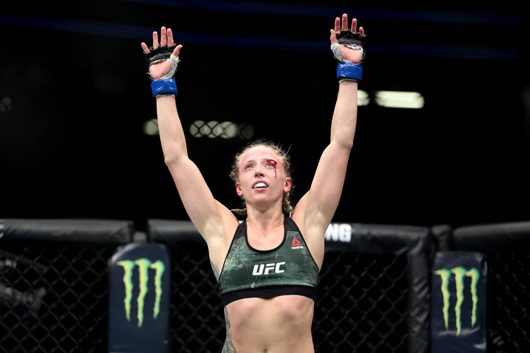 Emily Whitmire reacts at the end of the fight against Jamie Moyle in the womenÕs strawweig ...