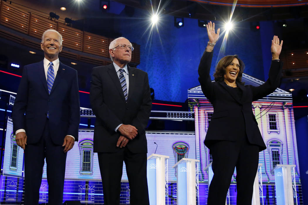 Democratic presidential candidates former vice president Joe Biden, left, Sen. Bernie Sanders, ...