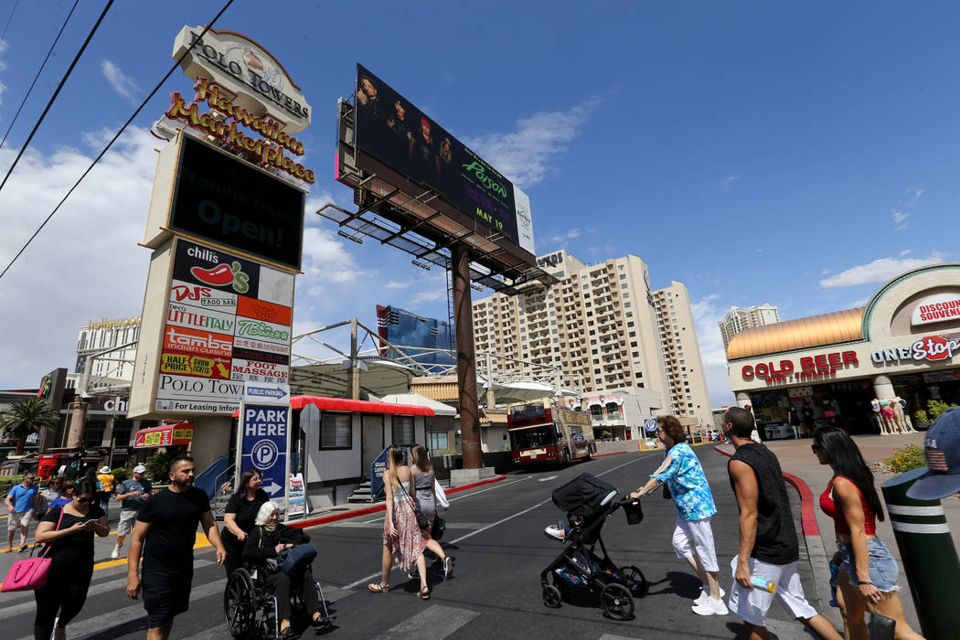 People walk on the Strip past the Hawaiian Marketplace Tuesday, May 22, 2018. A 16-acre piece o ...