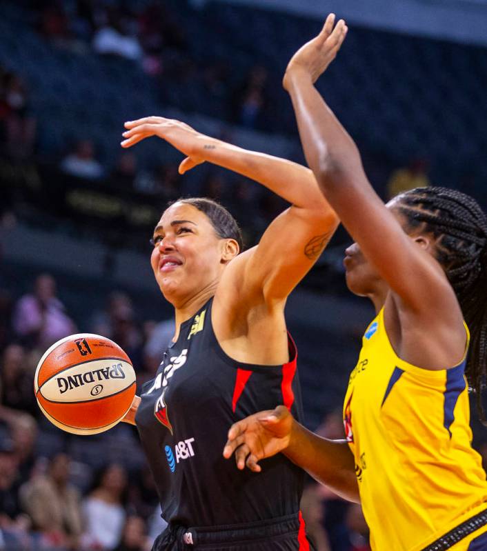 Las Vegas Aces center Liz Cambage, left, battles to the basket with Indiana Fever center Teaira ...