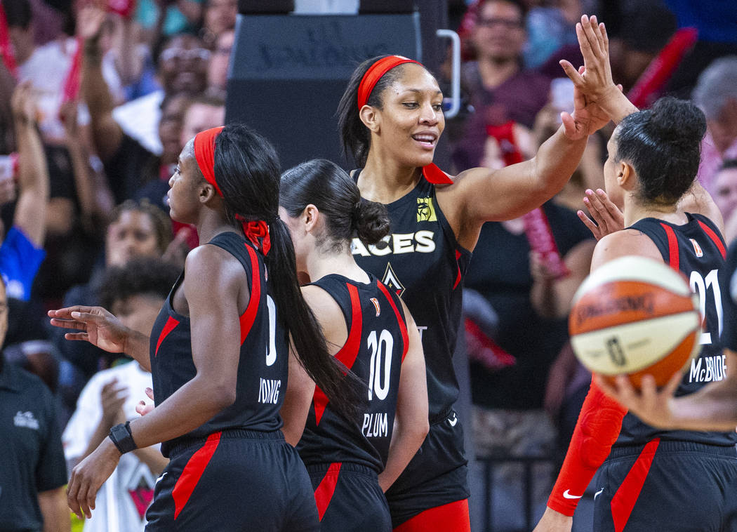 Las Vegas Aces forward A'ja Wilson celebrates a win with teammates after their overtime victory ...