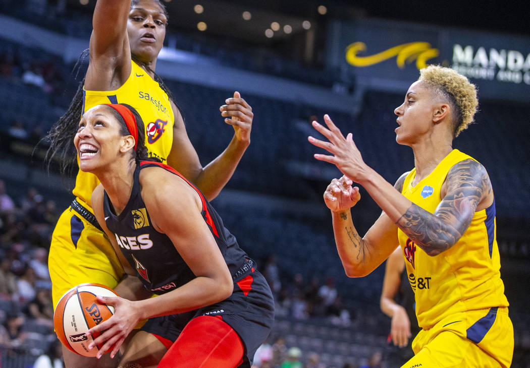 Las Vegas Aces forward A'ja Wilson (22) looks to the basket inside of Indiana Fever center Teai ...