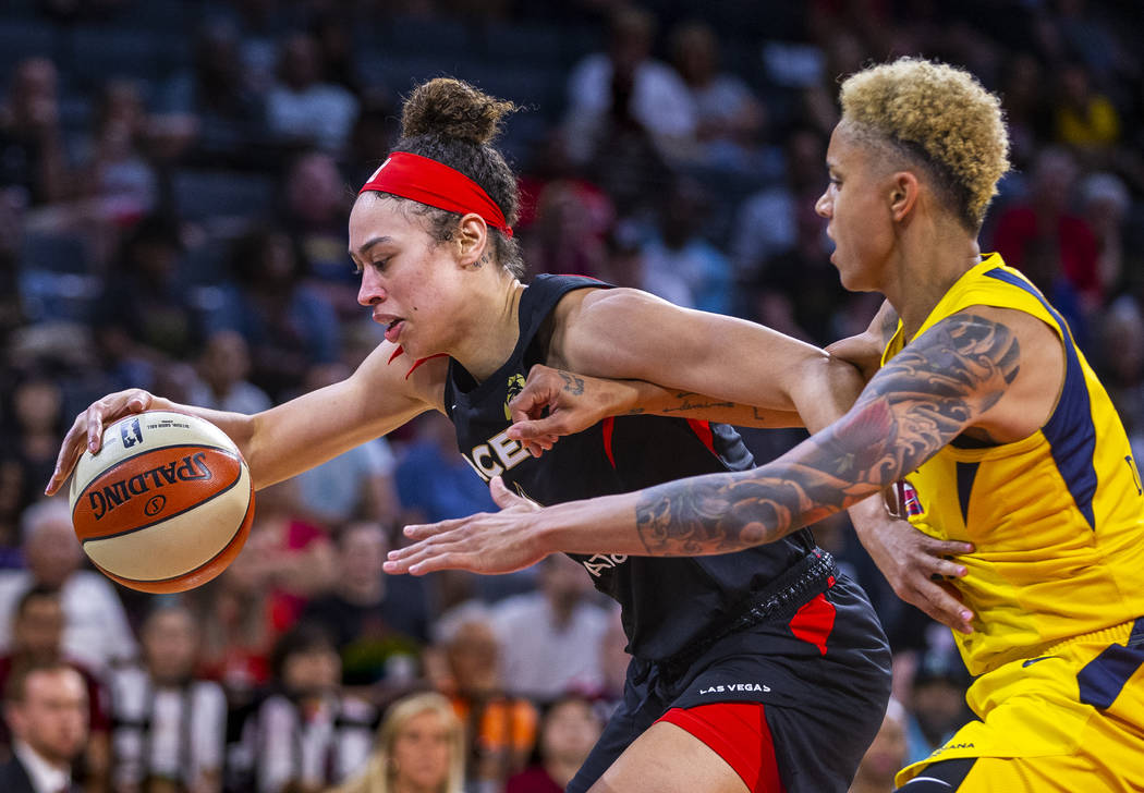 Las Vegas Aces forward Dearica Hamby (5) battles for room to shoot underneath the basket with I ...