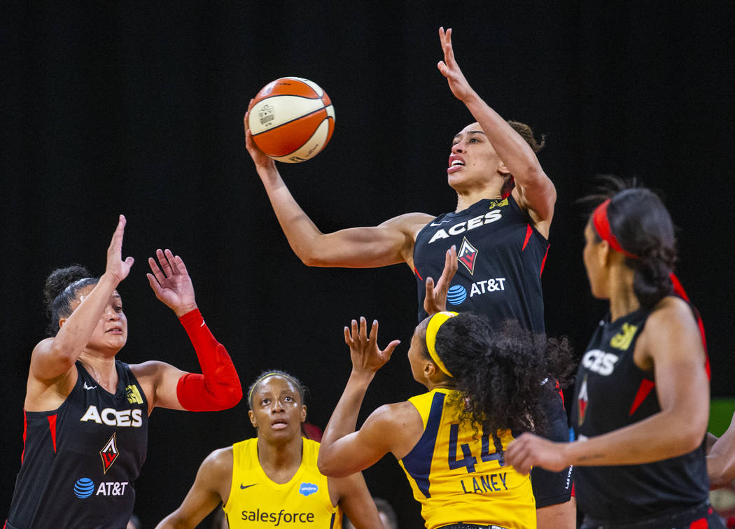 Las Vegas Aces forward Dearica Hamby (5) grabs a rebound underneath the basket over Indiana Fev ...