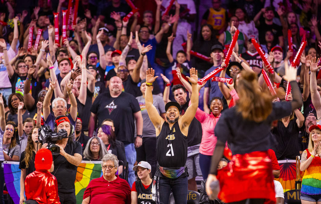 Las Vegas Aces fans get pumped for free merchandise during the fourth quarter of their WNBA bas ...