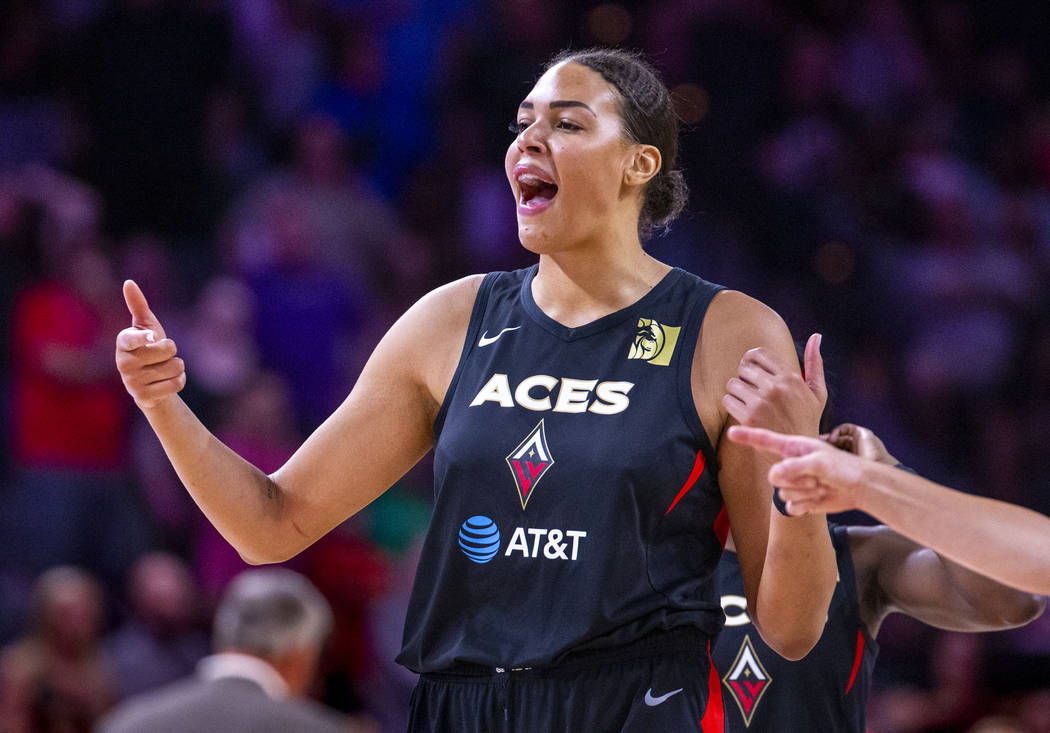 Las Vegas Aces center Liz Cambage (8) pumps up her teammates during the overtime period versus ...