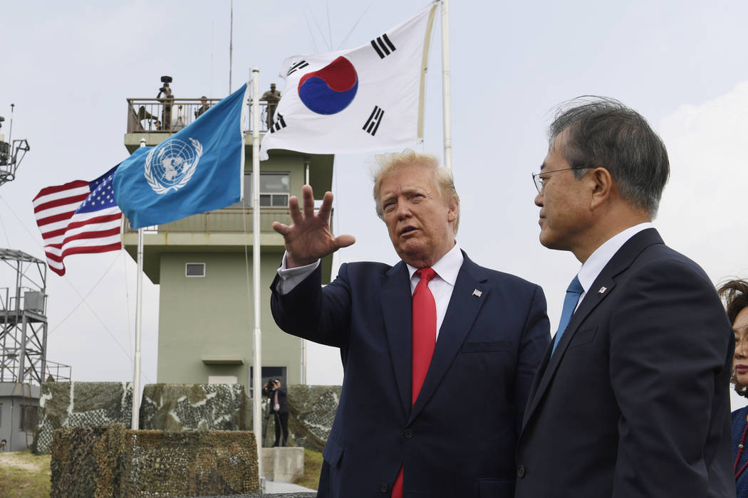 President Donald Trump talks with South Korean President Moon Jae-in and views North Korea from ...