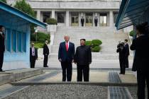 President Donald Trump and North Korean leader Kim Jong Un stand on the North Korean side in th ...