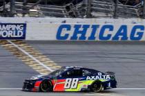 Alex Bowman crosses the finish line to win the NASCAR Cup Series auto race at Chicagoland Speed ...
