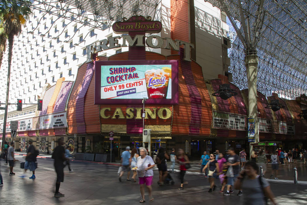 People walk by the Fremont Casino in Las Vegas, Wednesday, June 12, 2019. (Michael Blackshire/L ...