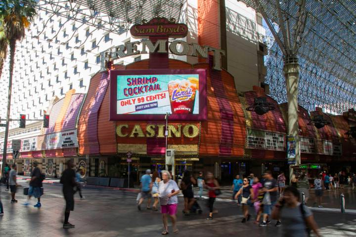 People walk by the Fremont Casino in Las Vegas, Wednesday, June 12, 2019. (Michael Blackshire/L ...