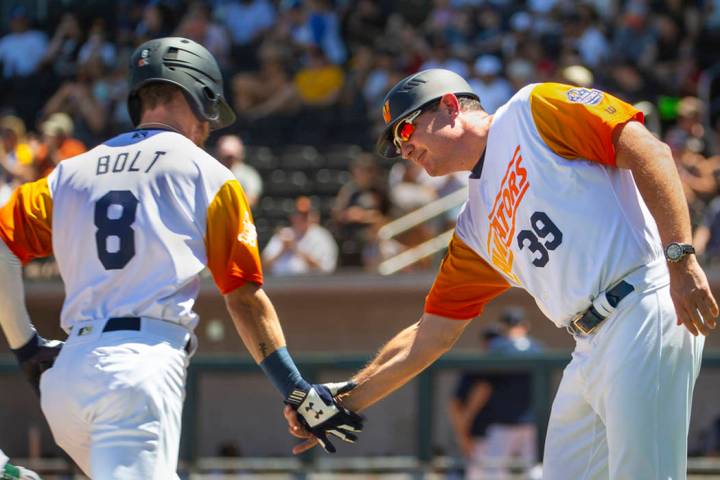 Skye Bolt is congratulated by Aviators manager Fran Riordan at the Las Vegas Ballpark in April ...