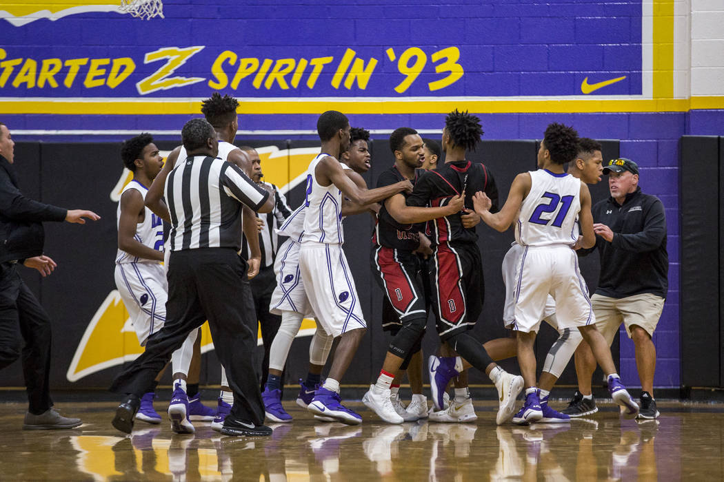A fight breaks out between Desert Oasis and Durango at Durango High School on Thursday, Jan. ...