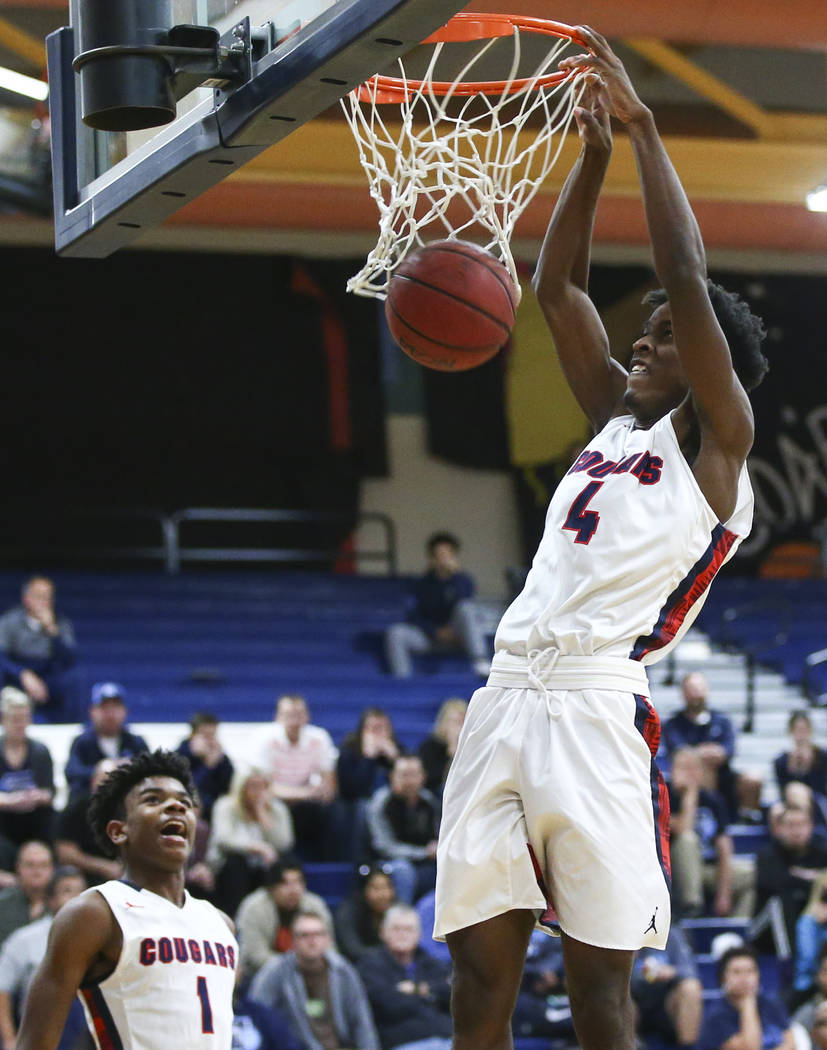 Coronado’s Tahj Comeaux (4) dunks against Foothill during a basketball game at Coronad ...