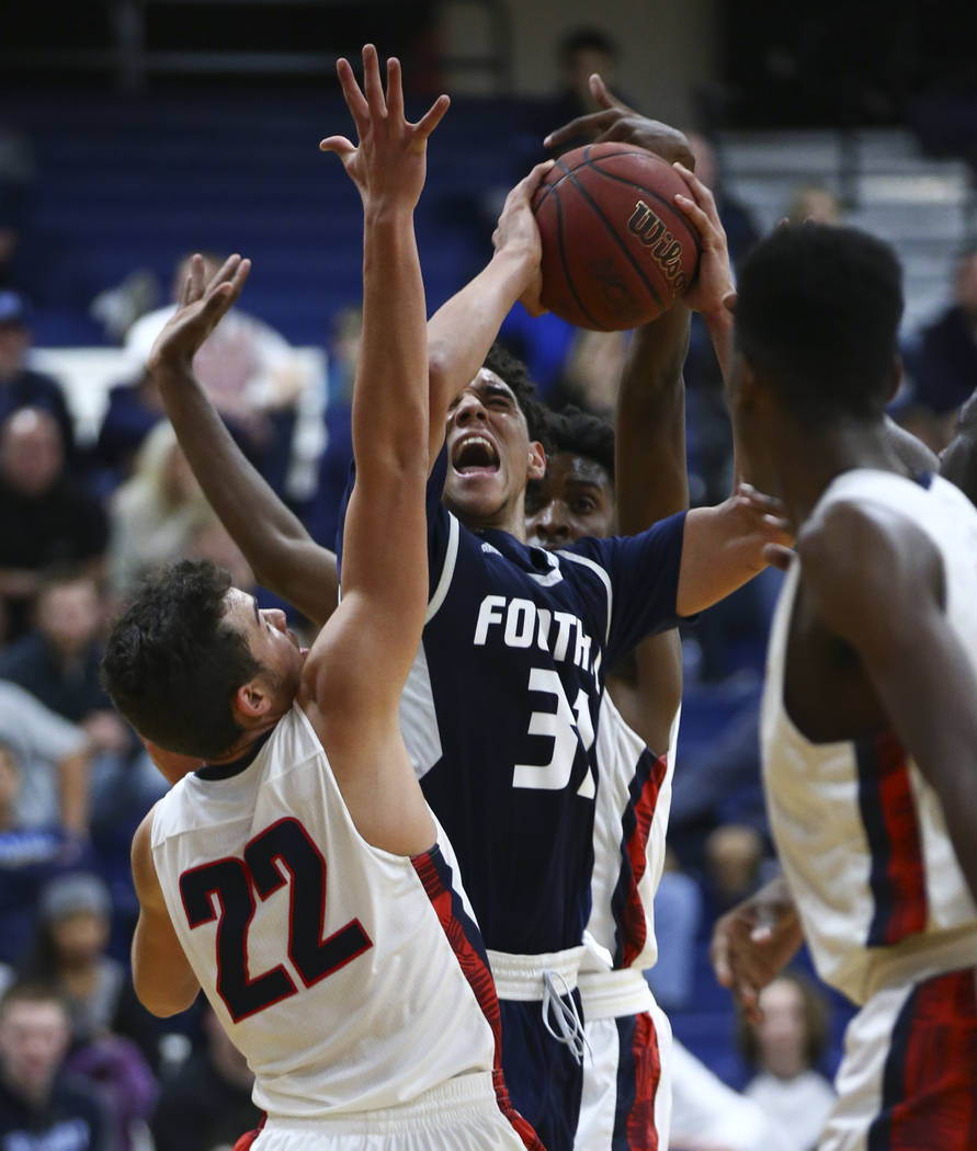 Coronado’s Patrick Simms (22) defends against Foothill’s Marvin Coleman (31) dur ...