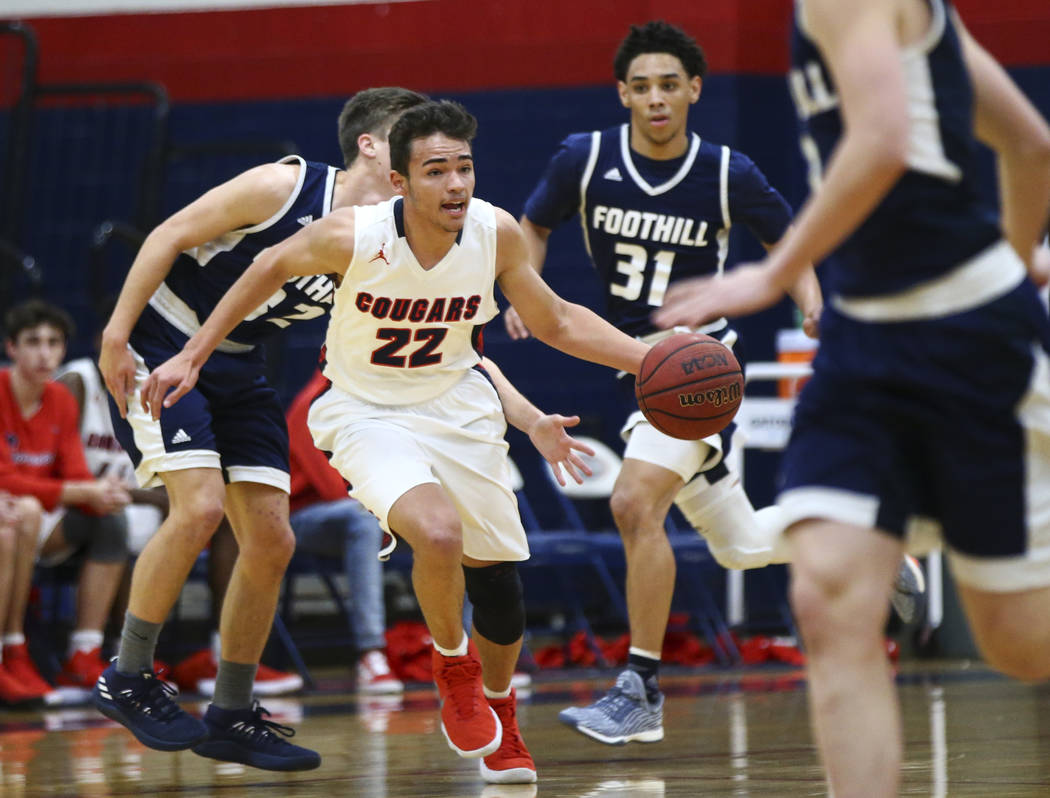 Coronado’s Patrick Simms (22) drives the ball against Foothill during a basketball gam ...