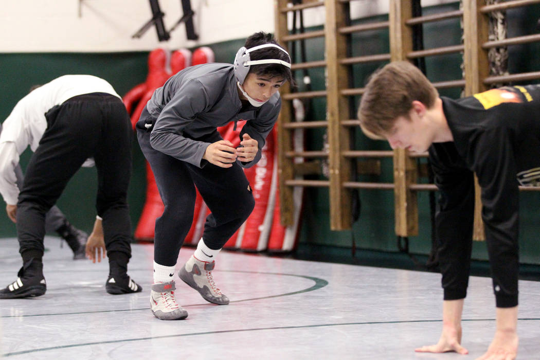 Green Valley High School junior wrestler Steele Dias warms up during practice at the school ...