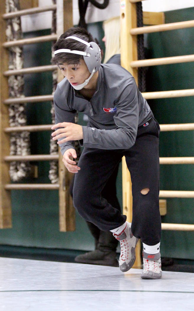 Green Valley High School junior wrestler Steele Dias warms up during practice at the school ...