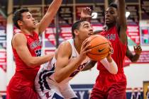 Liberty’s Julian Strawther (0) looks for a shot while Coronado’s Patrick Simms ( ...