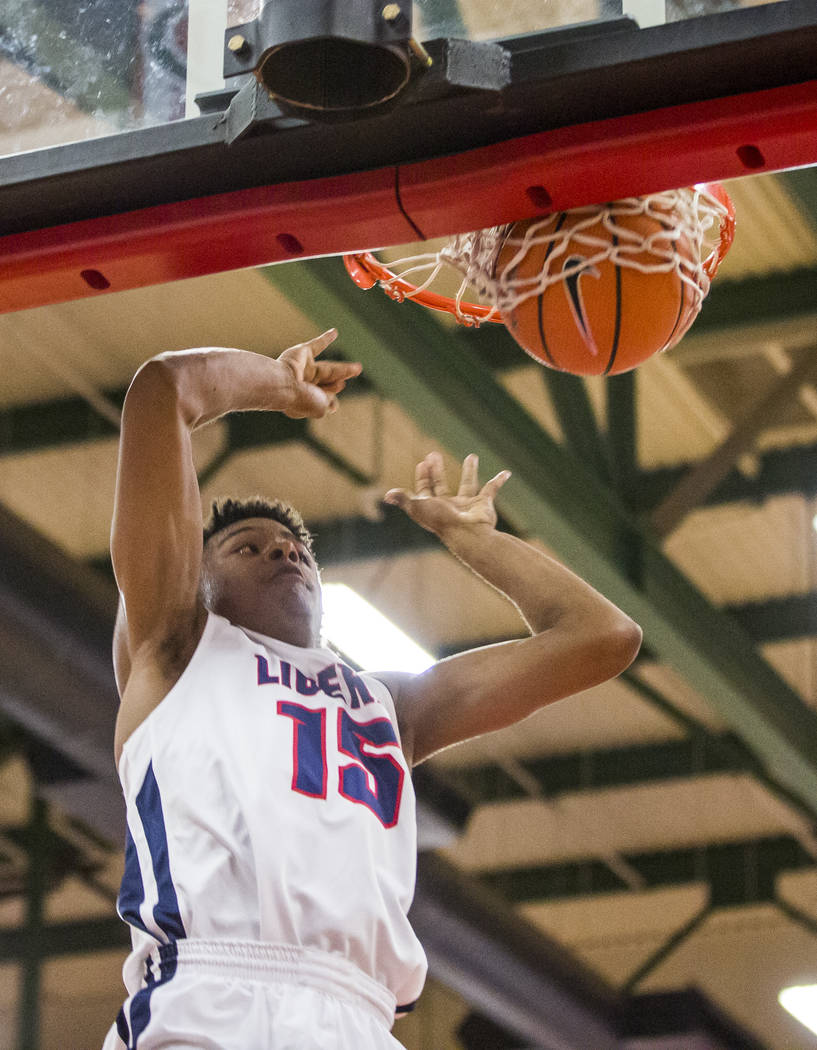Liberty’s Cameron Burist (15) dunks while playing against Coronado at Liberty High Sch ...