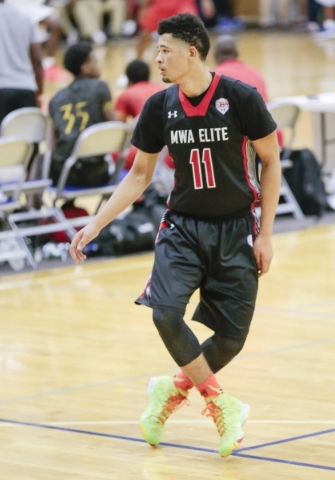 Point guard Skylar Mays of Mo Williams Elite loosens up behind the court during the Las Vega ...