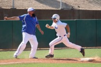 Bishop Gorman baserunner Grant Robbins is waved home by coach Gino DiMaria during a Sunset R ...