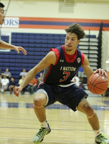 1Nation‘s Devon Daniels (3) dribbles the ball to the hoop in the U17 Las Vegas Fab 48 ...
