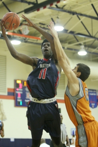 1Nation‘s Josh Jackson (11) goes up for a shot against BTI Select in the U17 Las Vegas ...