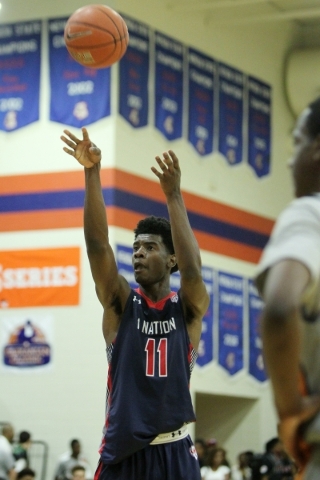1Nation‘s Josh Jackson (11) shoot a free throw against BTI Select in the U17 Las Vegas ...