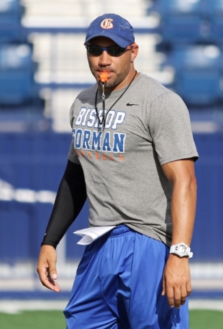 Bishop Gorman coach Kenny Sanchez runs offensive drills with the football team at Bishop Gor ...