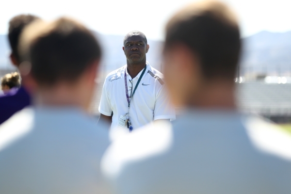 Randall Cunningham, Silverado High School head football coach, looks on during practice at S ...