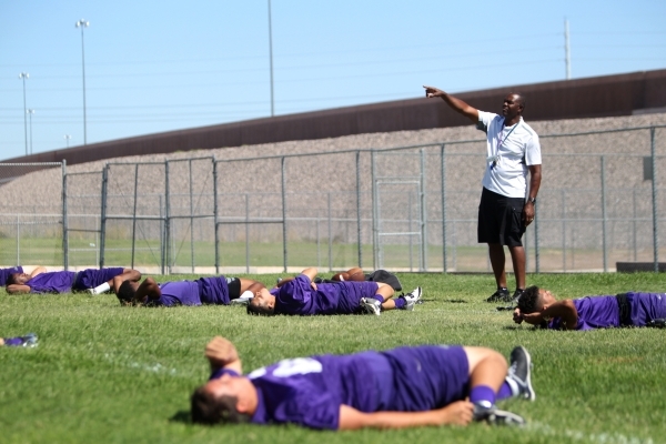 Randall Cunningham, Silverado High School head football coach, gives directions during pract ...