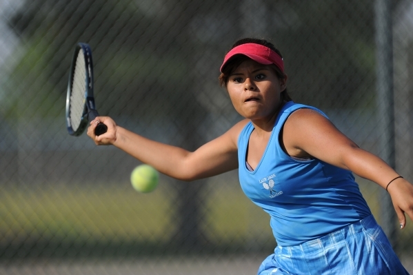 Senior Ashley Palacios, Desert Pines‘ No. 1 singles player, returns a serve during pra ...