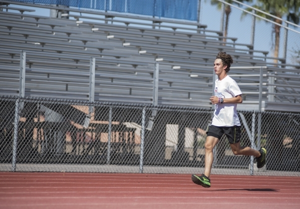 Green Valley High School senior Austin Rogers, 16, jogs during cross country practice at the ...