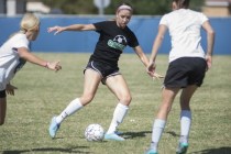 Green Valley High School junior Alexis Kirson, center, scrimmages with teammates Monday in H ...