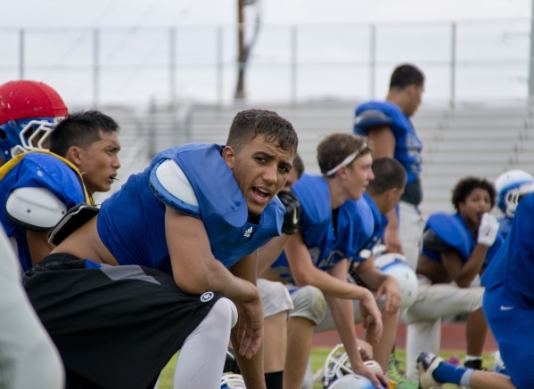 Basic High School quarterback Tank McAllister calls out to a teammate during practice at Don ...