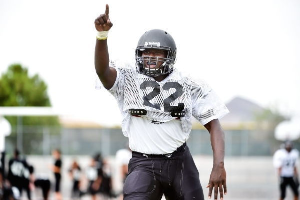 Palo Verde fullback and linebacker Chauntez Thomas gestures to teammates during football pra ...