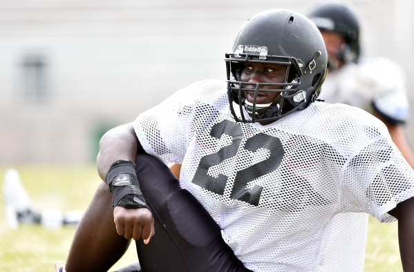 Palo Verde fullback and linebacker Chauntez Thomas stretches during football practice at Pal ...