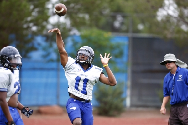 Desert Pines Marckell Grayson (11) throws a pass during football practice at Desert Pines Hi ...