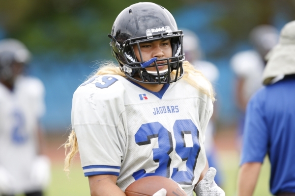 Desert Pines Vasa Hansell (39) runs the ball during football practice at Desert Pines High S ...