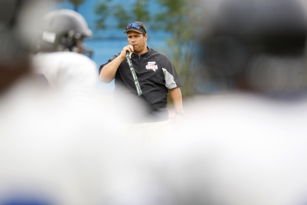 Desert Pines head football coach Tico Rodriguez blows the whistle during practice at Desert ...