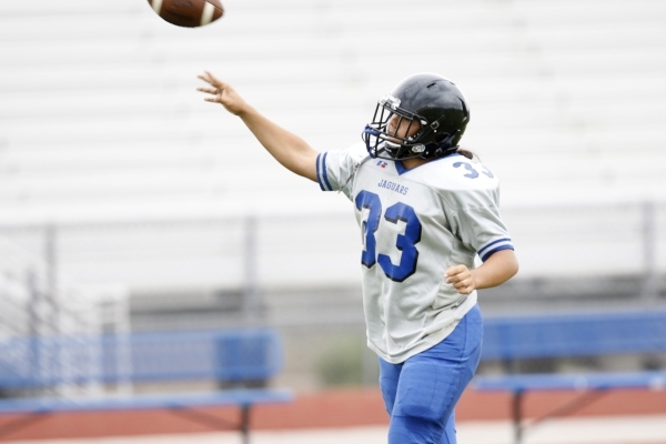 Desert Pines‘ Trevor Nofoa throws a pass Tuesday during practice. ERIK VERDUZCO/LAS VE ...