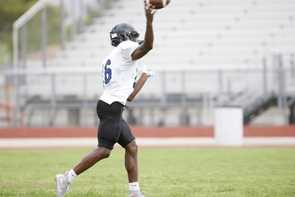 Desert Pines Randal Grimes (16) throws a pass during football practice at Desert Pines High ...