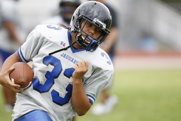 Desert Pines Trevor Nofoa (33) runs the ball during practice at Desert Pines High School in ...