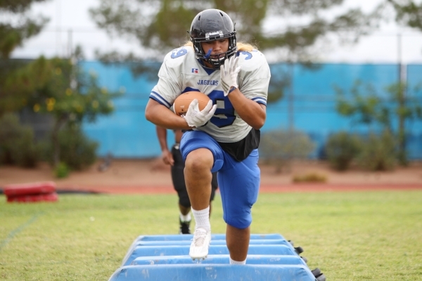 Desert Pines‘ Vasa Hansell runs during a drill at practice on Tuesday. The senior line ...
