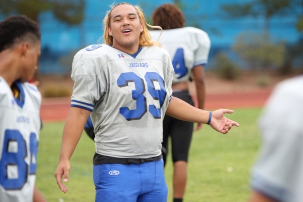 Desert Pines Vasa Hansell (39) speaks to a teammate during practice at Desert Pines High Sch ...