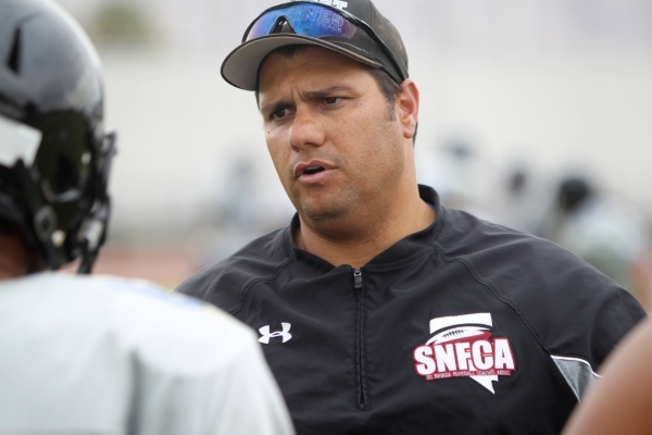 Desert Pines head coach Tico Rodriguez talks to players during practice on Tuesday. The Jagu ...