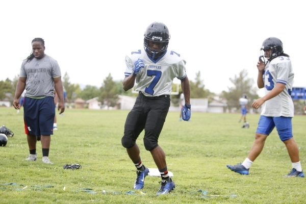 Desert Pines Isaiah Morris (7) runs a drill during football practice at Desert Pines High Sc ...