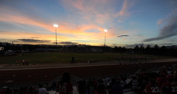 A view of Desert Pines football field as the sun sets in the first quarter of a high school ...